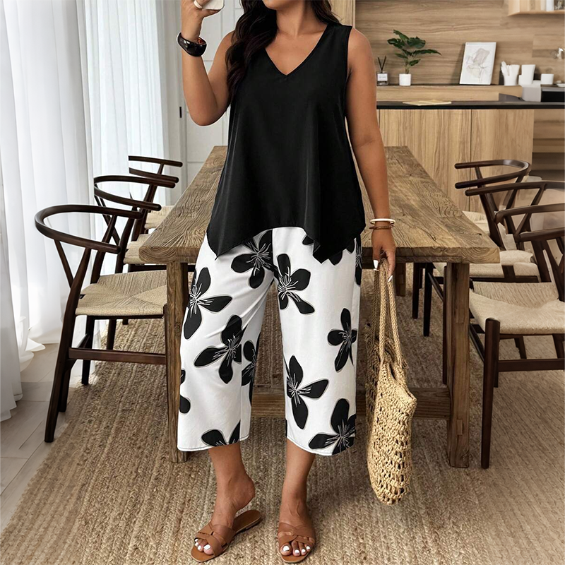 🌸 NUR FÜR KURZE ZEIT: 50 % RABATT! ✨ Set aus asymmetrischem Damenoberteil und Caprihose mit Blumenmuster – vielseitig, farbenfroh, bequem 🌺